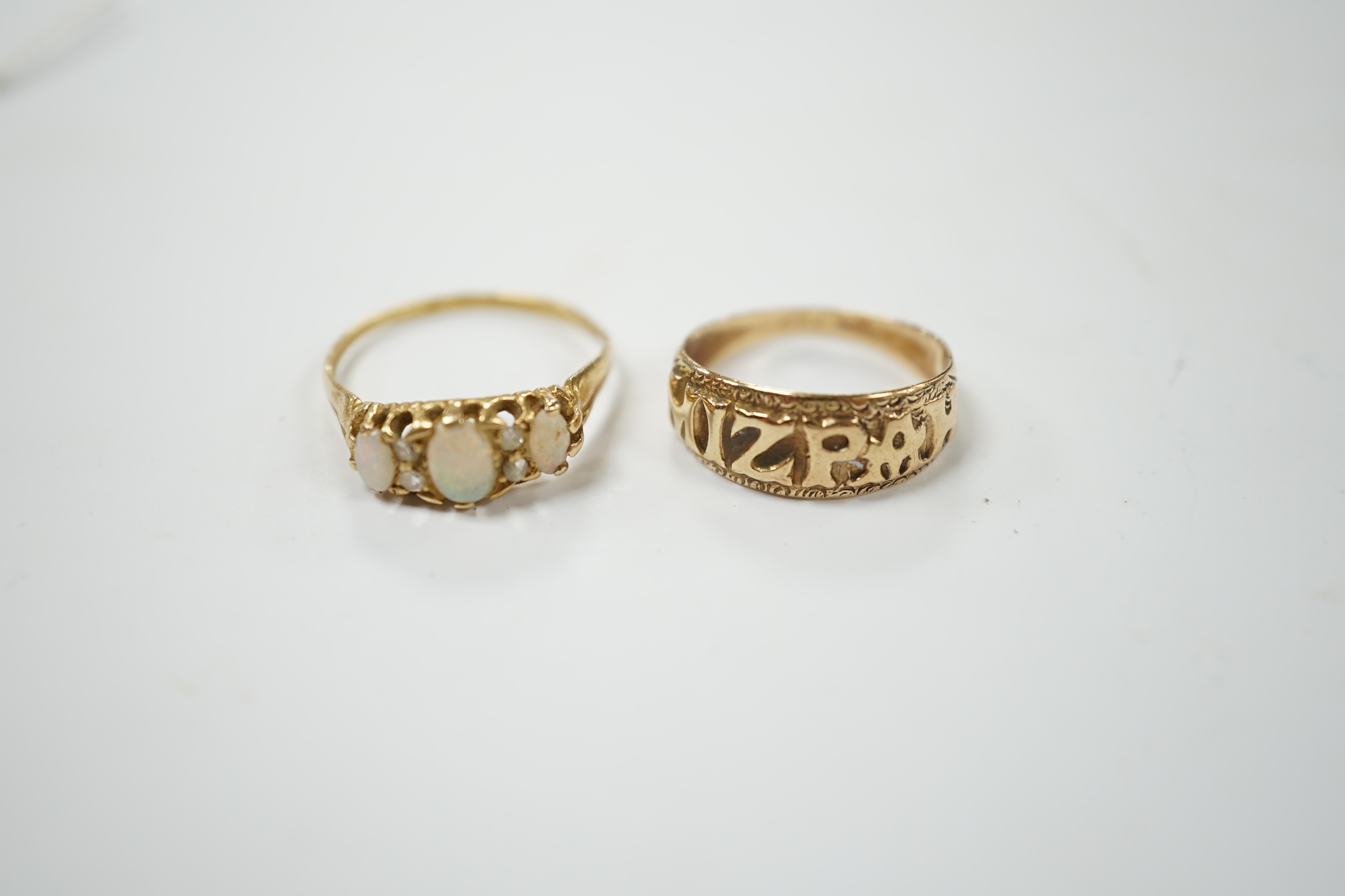 A 9ct gold 'Mizpah' ring and a yellow metal, three stone white opal set ring, with diamond chip spacers, size P, gross weight 5.2 grams. Condition - poor to fair